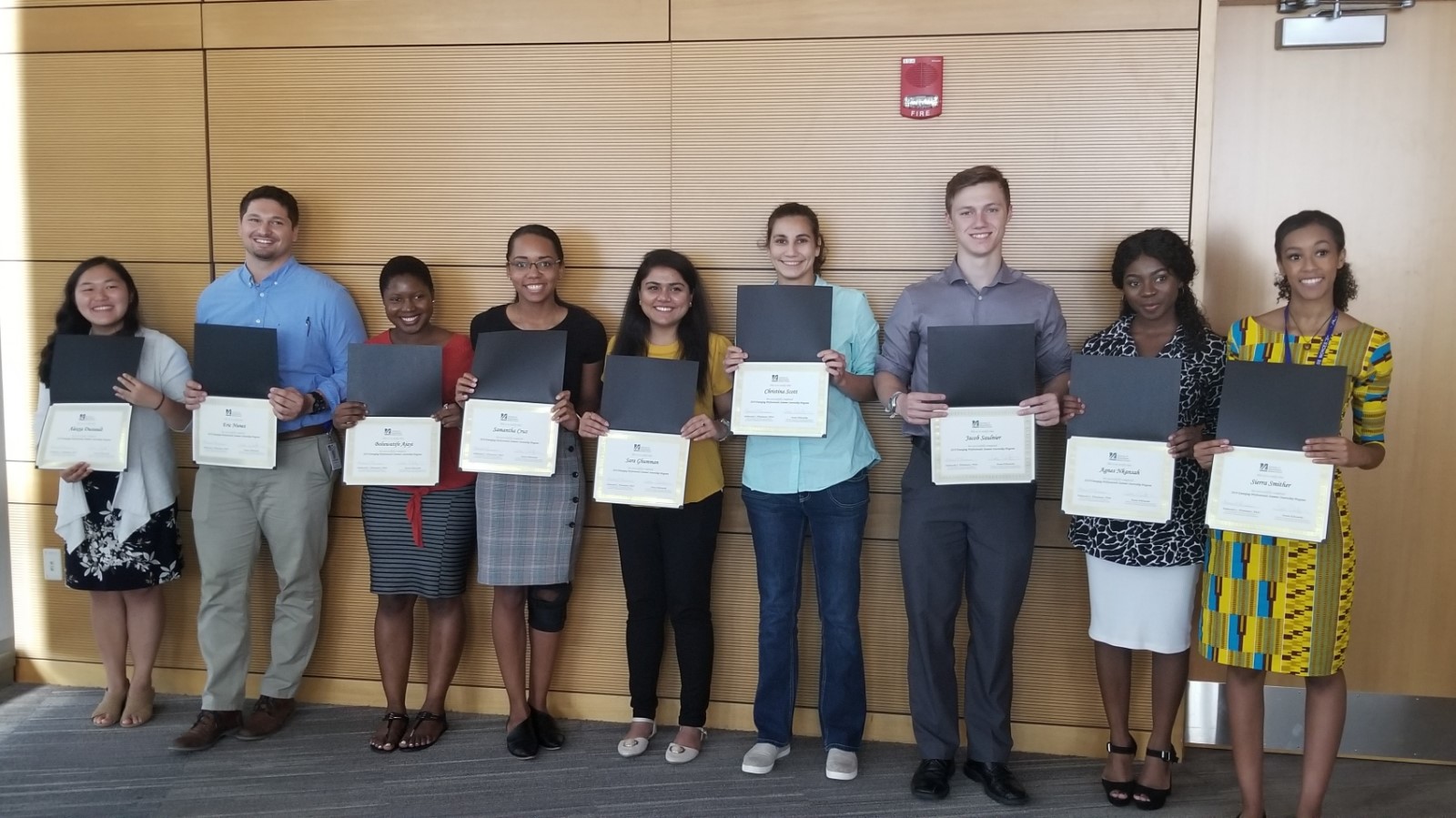 Group of interns with certificates of completion